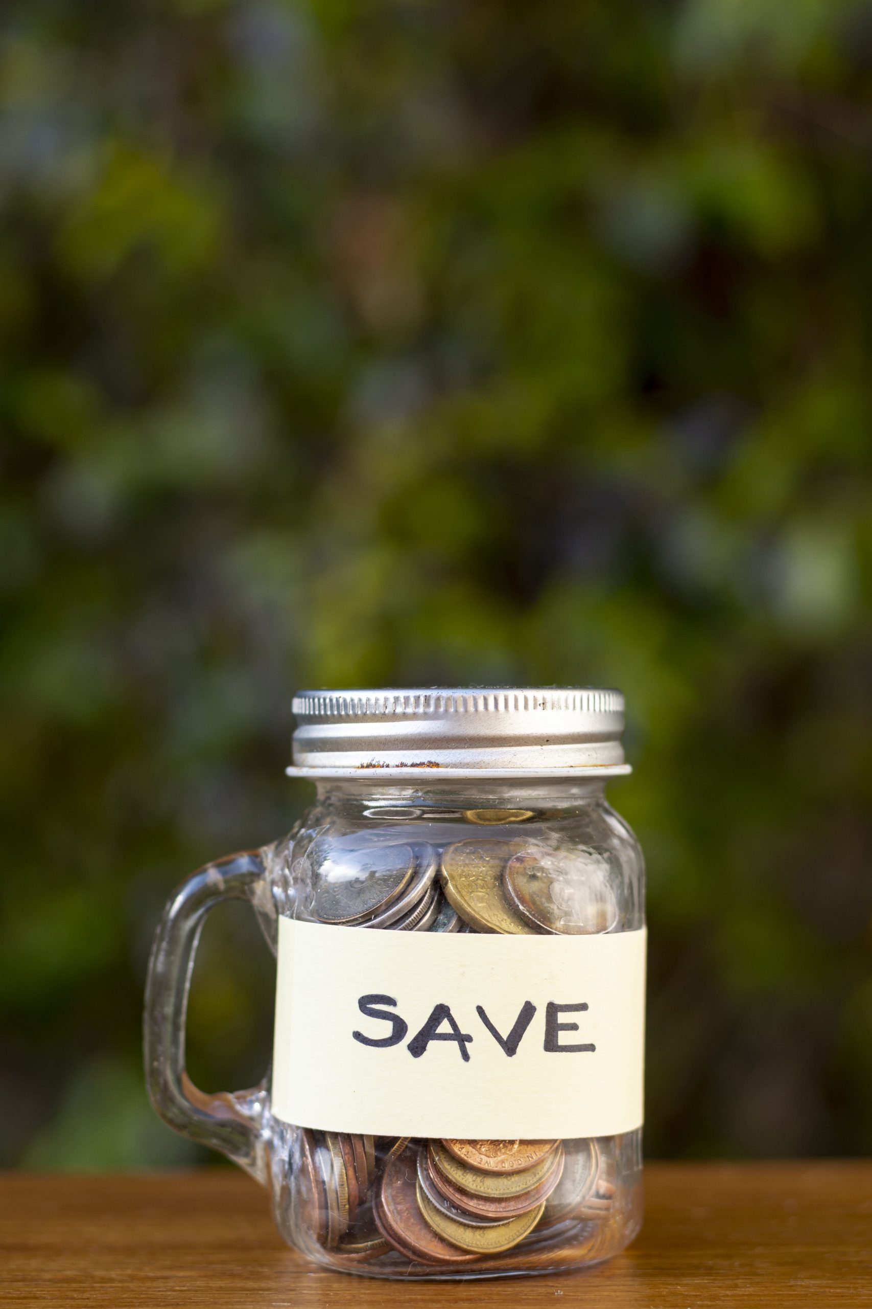 jar-with-coins-save-label-with-blurred-background (1)